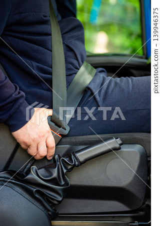 Driver fastening seat belt in car stock photo Driver fastening seat belt in car stock photo 139946375
