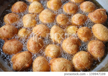 Round dough ball on Wok on fry Round dough ball on Wok on fry 139947109