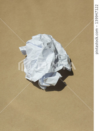 Crumpled paper isolated on brown background . Crumpled paper isolated on brown background . 139947122