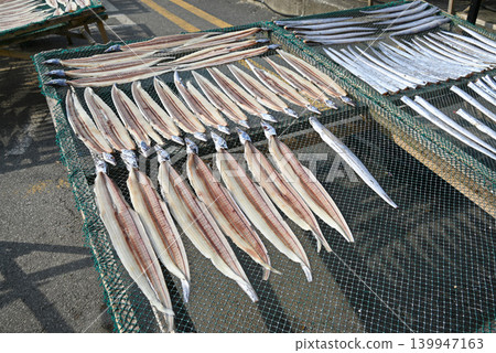 [Boryeong City, South Korea] Dried hairtail fish lined up at the street market in Daecheon Port. 139947163