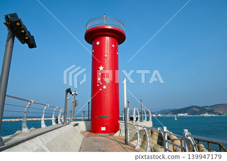 [Boryeong City, South Korea] A view of the red Daecheon Lighthouse standing on the quay of Daecheon Port. 139947179