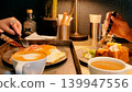 Two people enjoying breakfast at a stylish cafe. 139947556