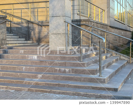 Modern Building Entrance with Tile Steps and Steel Railings Modern Building Entrance with Tile Steps and Steel Railings 139947890