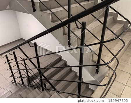 Looking Down Concrete Office Stairs with Metal Railing System Looking Down Concrete Office Stairs with Metal Railing System 139947893