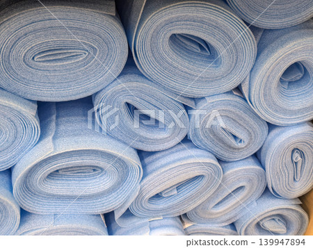 Stack of Blue Foam Underlayment Rolls for Flooring Stack of Blue Foam Underlayment Rolls for Flooring 139947894