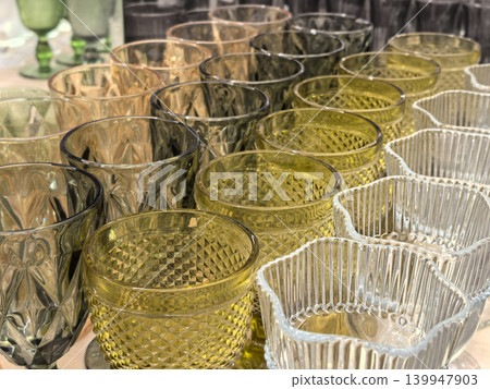 Colorful vintage glassware collection with diamond pattern goblets and tumblers Colorful vintage glassware collection with diamond pattern goblets and tumblers 139947903