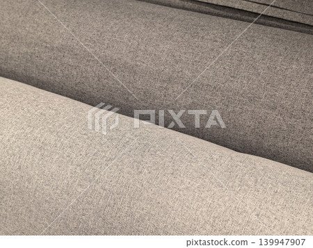 Beige and gray linen upholstery fabric close up texture on sofa Beige and gray linen upholstery fabric close up texture on sofa 139947907