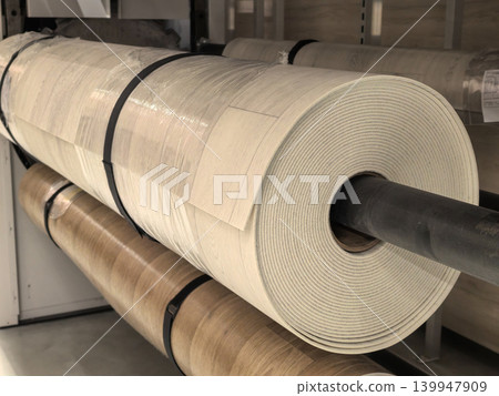 Rolls of vinyl linoleum flooring with light wood pattern in warehouse Rolls of vinyl linoleum flooring with light wood pattern in warehouse 139947909