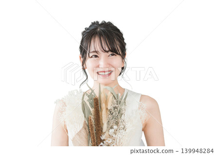 A smiling Japanese woman holding a bouquet of flowers (for a birthday, gift, or Mother's Day). 139948284