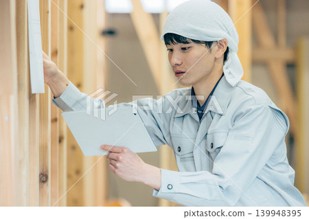 Workers working at a construction site Workers working at a construction site 139948395
