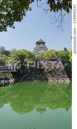 Osaka Castle reflected in the moat Osaka Castle reflected in the moat 139948541