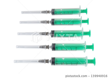 Medical syringes with green pistons on a white background Medical syringes with green pistons on a white background 139948916