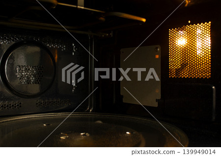 This is the inside of a microwave oven.	 139949014