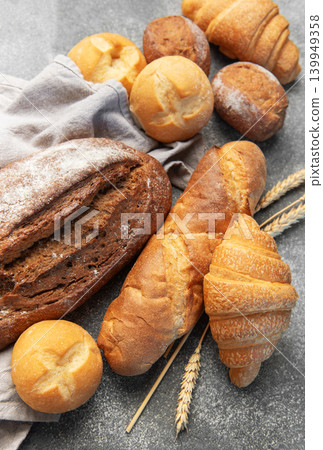 Assortment of fresh baked bread, pastry, and wheat Assortment of fresh baked bread, pastry, and wheat 139949358