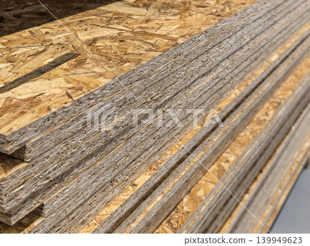 Stacked OSB Sheets Texture for Construction Projects Stacked OSB Sheets Texture for Construction Projects 139949623