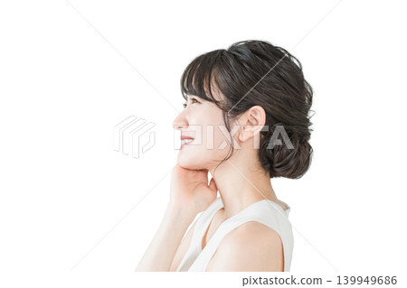 A profile view (E-line, jawline) of an Asian woman with beautiful skin who is taking care of her skin. A profile view (E-line, jawline) of an Asian woman with beautiful skin who is taking care of her skin. 139949686