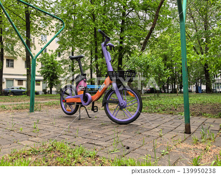 Shared Electric Bicycle Parked Under Metal Arch Frame Shared Electric Bicycle Parked Under Metal Arch Frame 139950238