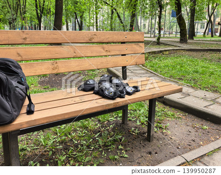 Roller Skating Protective Gear on Wooden Park Bench 139950287