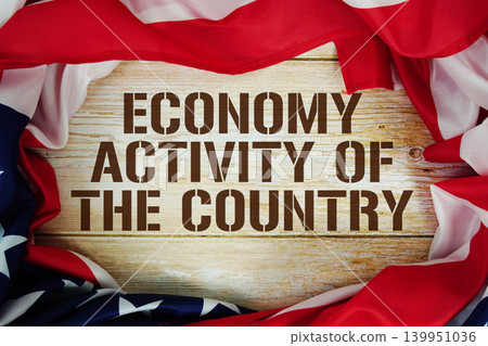 American flag with "Economy Activity of The Country" on wooden background American flag with "Economy Activity of The Country" on wooden background 139951036