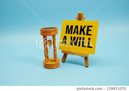 Make a Will text with hourglass on blue background 139951070