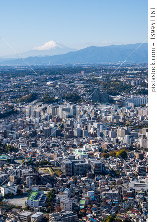 A spectacular view of the city and snow-capped Mount Fuji from Yokohama Landmark Tower (vertical composition). A spectacular view of the city and snow-capped Mount Fuji from Yokohama Landmark Tower (vertical composition). 139951161