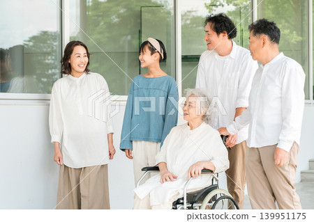 A three-generation family visiting a hospital or nursing home A three-generation family visiting a hospital or nursing home 139951175