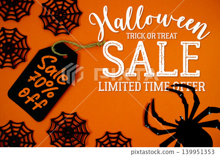 Halloween Sale 70% on orange background featuring a black gift tag, spider webs, and a creepy spider for Halloween-themed labels, party invites, or seasonal promotions. 139951353