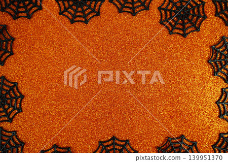 Halloween background with spiderwebs, and orange background for Halloween celebrations, party invitations, or seasonal promotions Halloween background with spiderwebs, and orange background for Halloween celebrations, party invitations, or seasonal promotions 139951370