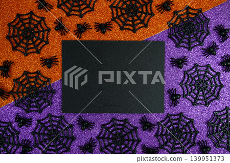 Glitter Halloween card mockup with Spiders and Webs in Orange and Purple Theme Glitter Halloween card mockup with Spiders and Webs in Orange and Purple Theme 139951373
