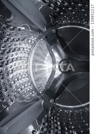 Inside of the washing machine drum . Inside of the washing machine drum . 139952217
