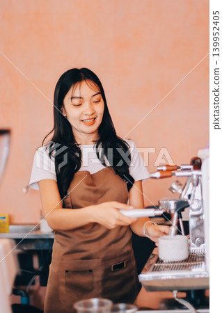 Young woman at barista school learning how to make espresso coffee. 139952405