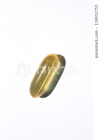 It is a pill placed on a white background. 139952755