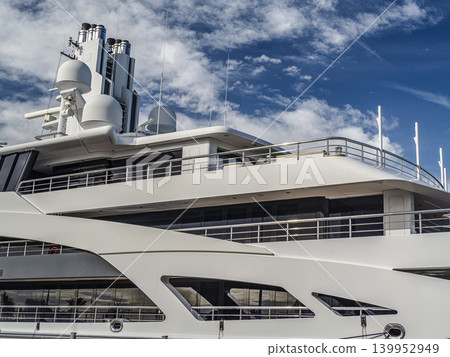 Closeup of Luxury Cruise Ship Docked at Port and Blue Sky 139952949