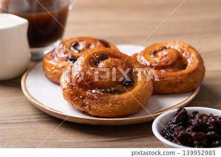French Pain au Raisin, Cinnamon Raisin Swirl and hot coffee  139952985