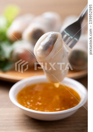 Thai Fresh Spring Rolls with Herbs and Vegetables eating with spicy dipping sauce Thai Fresh Spring Rolls with Herbs and Vegetables eating with spicy dipping sauce 139952995