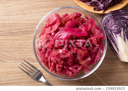 Red cabbage sauerkraut in a glass bowl with fresh red cabbage Red cabbage sauerkraut in a glass bowl with fresh red cabbage 139953023