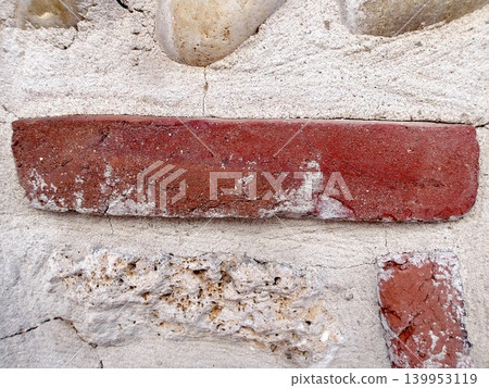 Weathered red brick in historic wall with efflorescence. Weathered red brick in historic wall with efflorescence. 139953119