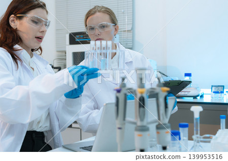 Diverse Scientists Conduct Biotechnology Research in Modern Laboratory Diverse Scientists Conduct Biotechnology Research in Modern Laboratory 139953516