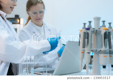 Diverse Scientists Conduct Biotechnology Research in Modern Laboratory 139953517