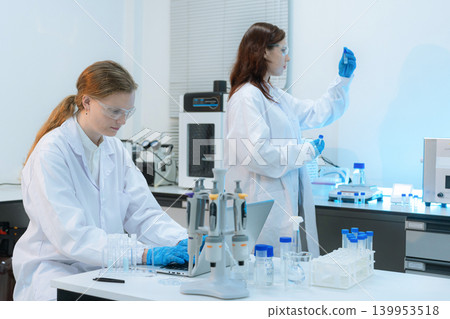 Diverse Scientists Conduct Biotechnology Research in Modern Laboratory 139953518