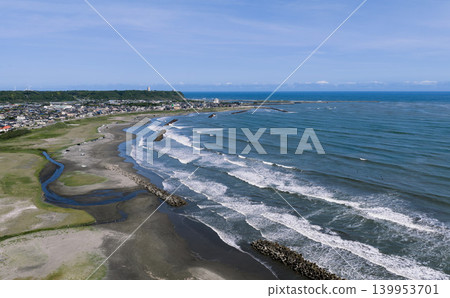 Aerial view of the surf beach and breakwater around Iioka, Chiba Prefecture. Aerial view of the surf beach and breakwater around Iioka, Chiba Prefecture. 139953701