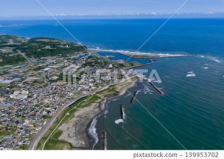 Aerial view of Iioka Fishing Port in Chiba Prefecture and the Pacific coast. Aerial view of Iioka Fishing Port in Chiba Prefecture and the Pacific coast. 139953702