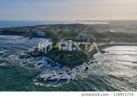 Aerial view of Inubosaki Lighthouse and the Pacific coast at dusk. Aerial view of Inubosaki Lighthouse and the Pacific coast at dusk. 139953735