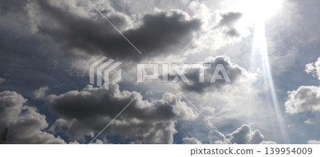 Bright sunlight pierced the dramatic cloudy sky. Bright sunlight pierced the dramatic cloudy sky. 139954009