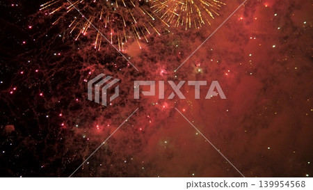 Pyrotechnic Display Fades. Explosive Light Scatters Into Smoke. Fireworks Merge With Mist In Grand Spectacle. Bright Explosions Blend Into Foggy Backdrop For Dramatic Ending 139954568