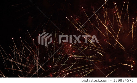 Bright Night Fireworks. Vivid Sparks Illuminate Evening Sky. Spectacular Fireworks Light Up Dark Night. Colorful Explosions Fill Darkness With Radiant Brilliance And Sparks Bright Night Fireworks. Vivid Sparks Illuminate Evening Sky. Spectacular Fireworks Light Up Dark Night. Colorful Explosions Fill Darkness With Radiant Brilliance And Sparks 139954575