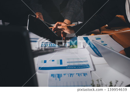 Professional photo of a person's hands reviewing a contract or legal document on a desk, for concepts of business, finance, and legal affairs Professional photo of a person's hands reviewing a contract or legal document on a desk, for concepts of business, finance, and legal affairs 139954639