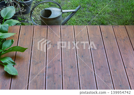 Wooden Terrace Planks with Vintage Watering Can Wooden Terrace Planks with Vintage Watering Can 139954742