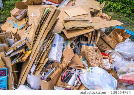 Yokohama, Japan: Collection day for used paper and textiles. Cardboard boxes and paper piled high... = Yokohama city Yokohama, Japan: Collection day for used paper and textiles. Cardboard boxes and paper piled high... = Yokohama city 139954754