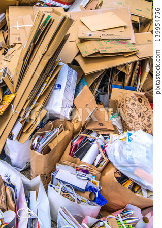 Yokohama, Japan: Collection day for used paper and textiles. Cardboard boxes and paper piled high... = Yokohama city 139954756